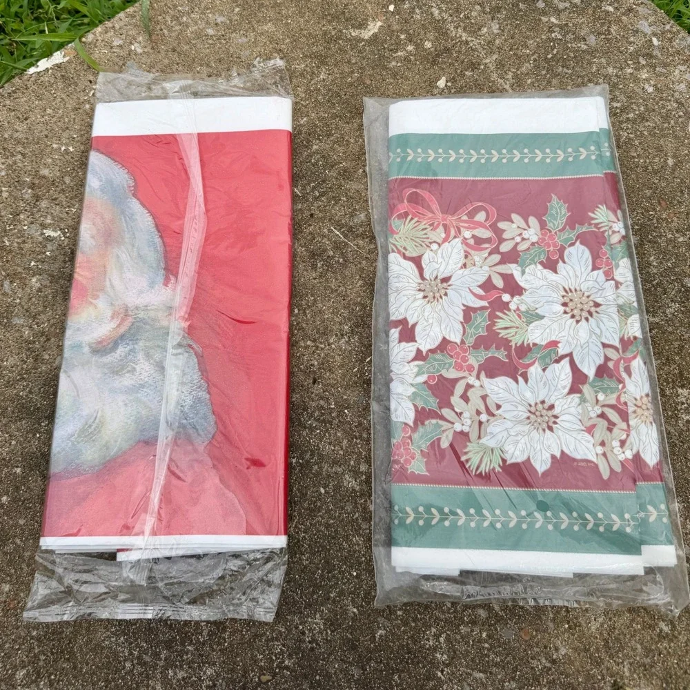 VTG Lot of 2 DesignWare Christmas Plastic Tablecloths Santa Poinsettia 54x96 New